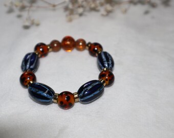 Pulsera de cuentas de vidrio azul y ámbar hecha a mano - Inspiración africana