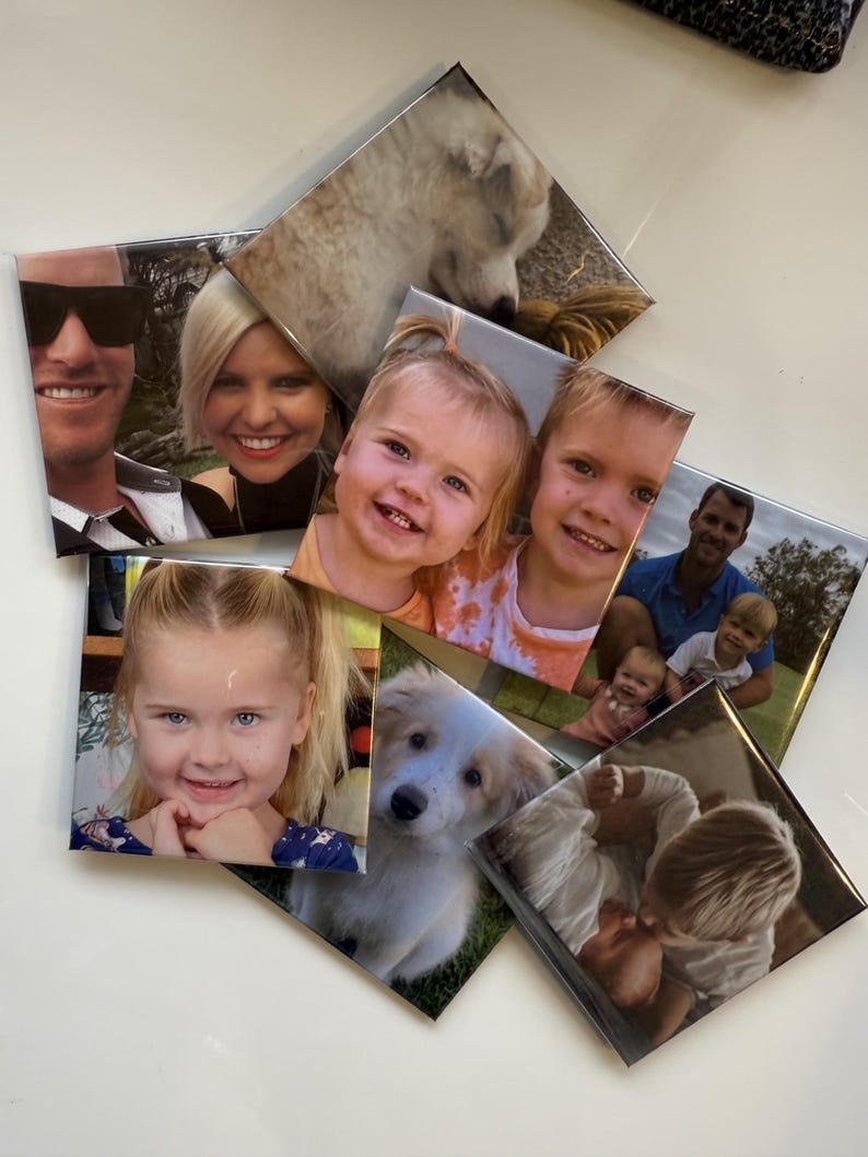May include: A collection of square photo tiles featuring various family portraits and a dog. The images include smiling faces of adults, children, and a fluffy white and tan puppy. The tiles are arranged in a slightly overlapping pattern.