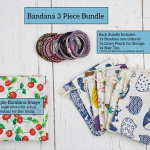 May include: A bandana bundle with a cherry print bandana, hair ties, and linen pouches. The image includes a sample bandana image, and the text "Bandana 3 Piece Bundle". Each bundle includes a bandana, linen pouch, and hair ties.
