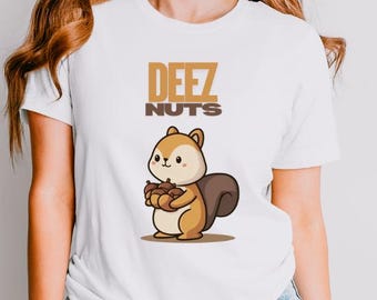 May include: White t-shirt with the text "DEEZ NUTS" above a cartoon squirrel holding nuts. The squirrel is brown and tan with a fluffy tail. The shirt is paired with light blue jeans.