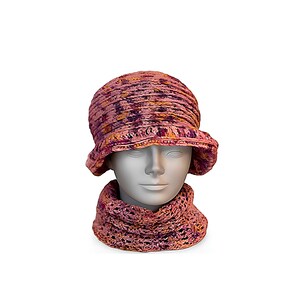May include: A pink, purple, and orange crocheted hat and cowl set. The hat has a rounded crown and a small brim. The cowl is a matching color and pattern. The set is displayed on a mannequin head against a white background.