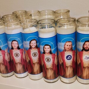 May include: A row of 15 white candles with images of hockey players dressed as Jesus. Each candle features a different player and a different hockey team logo.