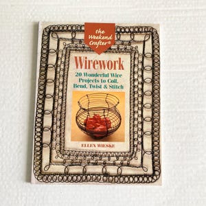 May include: A book titled "Wirework" by Ellen Wieske, featuring a wire basket on the cover. The cover has a brown border with the text "the Weekend Crafter®". The book details 20 wire projects to coil, bend, twist, and stitch.