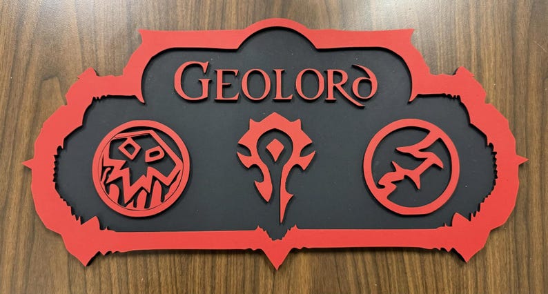 May include: A red and black wooden sign with the name "GEOLORD" in red lettering. The sign features three circular emblems and a decorative red border. The sign is likely a decorative item or a piece of fan art.