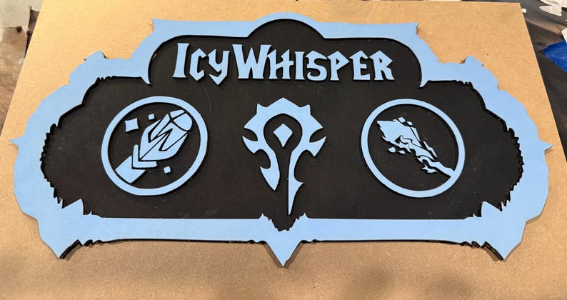 May include: A wooden sign with the text "Icy Whisper" in light blue, featuring three symbols. The sign has a black center and a light blue border. The symbols are also light blue and set in circles.