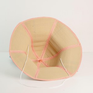 Interior view of the straw hat, highlighting reinforced stitching and comfortable lining. Lightweight yet strong, ensuring long-lasting wear.