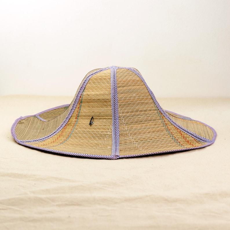 Two straw hats displayed together classic, foldable, and stylish. Perfect for outdoor adventures, travel, and sun protection while staying eco-friendly.