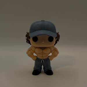 May include: A Funko Pop vinyl figure of a muscular character wearing a blue baseball cap and grey sweatpants. The figure has a tan skin tone, black eyes, and brown hair. The figure is posed with hands on hips.
