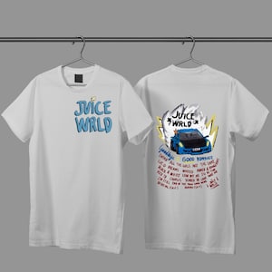 May include: White t-shirts with graphic designs. One shirt features "JUICE WRLD" in blue text. The other shirt has a blue car graphic with text including "JUICE WRLD" and song titles like "Goodbye" and "Good Riddance".