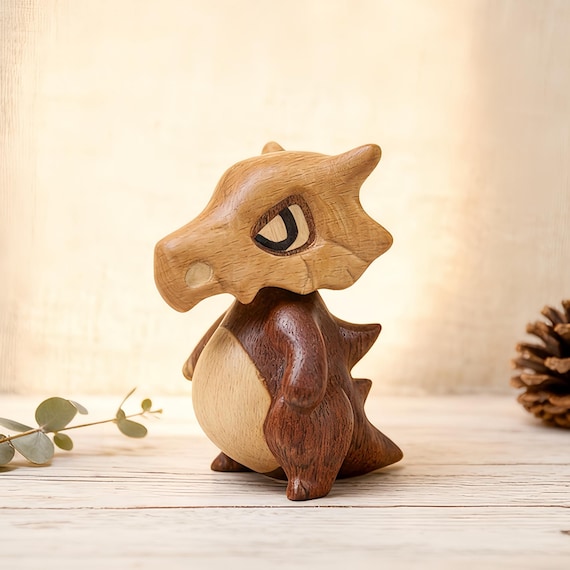 A beech and ebony wooden dinosaur with a satisfyingly magnetic nodding head — tactile, handsome, and surprisingly hard to put down.