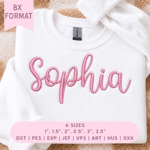 May include: A white sweatshirt featuring the name Sophia embroidered in pink cursive script. The image includes text indicating BX FORMAT and 6 SIZES: 1 inch, 1.5 inches, 2 inches, 2.5 inches, 3 inches, 3.5 inches, along with file formats DST, PES, EXP, JEF, VP3, ART, HUS, XXX.