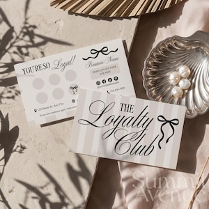 May include: Two rectangular loyalty cards with a beige and white striped design. One card features the text "THE Loyalty Club" with a black bow icon. The other card displays "YOU'RE SO Loyal!" with six circular punch spots, social media icons, and contact details.