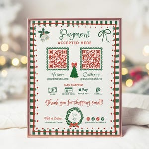 May include: A framed sign with a Christmas theme. The sign reads "Payment Accepted Here" and includes QR codes for Venmo and Cashapp. It also lists accepted payment methods. The sign is decorated with red and green accents and the text "Thank you for shopping small!"