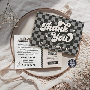 May include: A set of thank you cards with a retro design. The main card features a checkerboard pattern with the words "Thank You" in a bold, white font. A smaller card includes a message and social media handles.