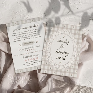 May include: Two rectangular thank you cards featuring a light beige and white gingham pattern with small floral accents. One card displays the text you just made our day and includes space for a discount code, while the other says thanks for shopping small.