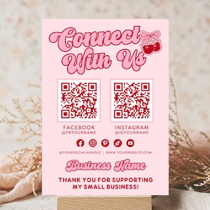 May include: A pink and red printable sign with the text "Connect With Us" and two QR codes. The sign also includes social media icons and the text "Business Name" and "Thank you for supporting my small business!"