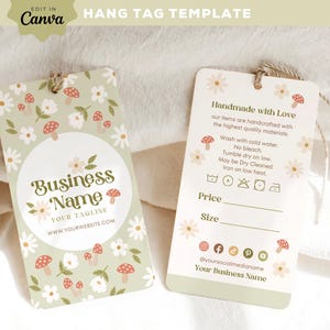 May include: A green hang tag with a floral pattern and mushrooms. The tag has the text "Business Name" and "Your Tagline" with a website address. The back of the tag has instructions for care, price and size fields, and social media icons.