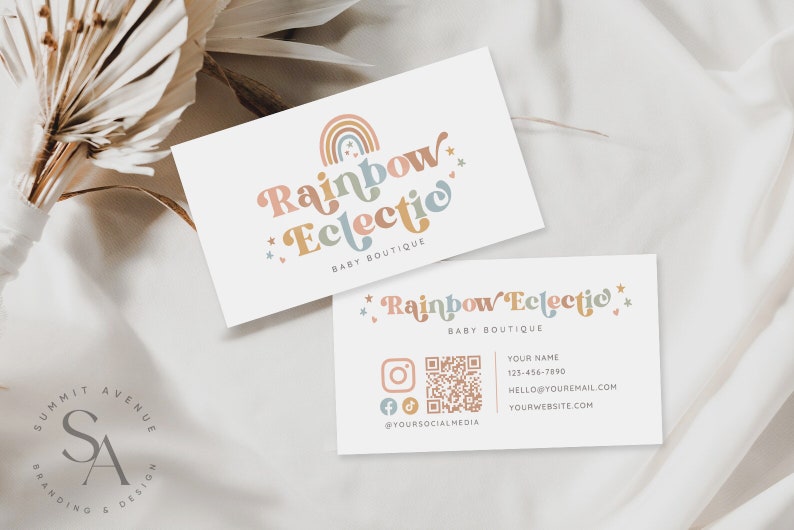May include: Two business cards with a rainbow and stars design. The text on the card reads "Rainbow Eclectic Baby Boutique". The card also includes a QR code, social media icons, and contact information.