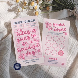 May include: Two pink loyalty cards with floral accents and text. One card reads "Today is going to be a beautiful day!" and the other says "You're so Loyal." The cards are on a white textured surface with flowers.