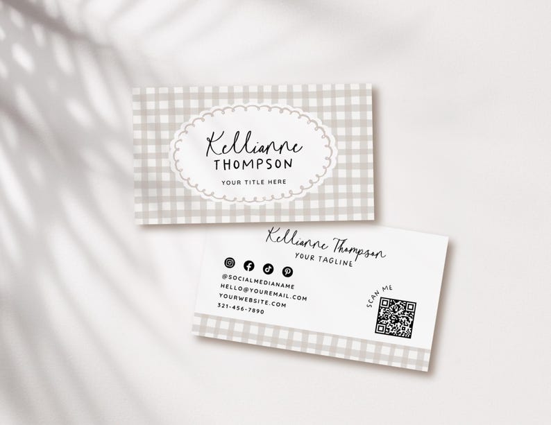 May include: Two business cards with a light gray gingham pattern. The top card has the name "Kellianne Thompson" in script within a scalloped oval, with "YOUR TITLE HERE" below. The bottom card includes social media icons, contact info, and a QR code.