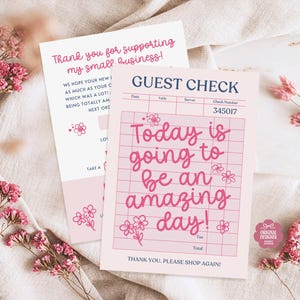 May include: Pink guest check with the text "Today is going to be an amazing day!" and a matching thank you card. Both cards have floral accents and are set against a neutral background with pink flowers.
