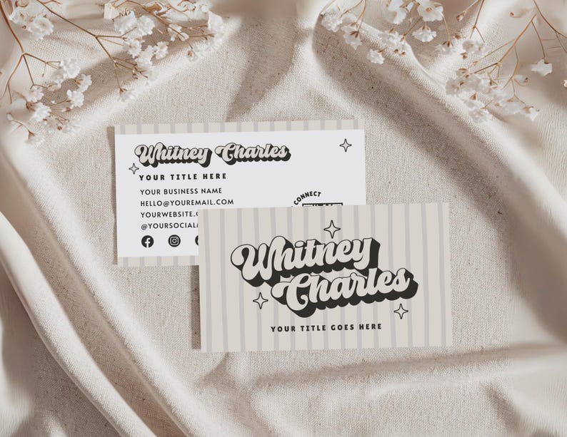 May include: Two business cards featuring the text "Whitney Charles" in a retro font. One card has vertical stripes and the other has the business name, title, email, website, and social media handles. The cards are light beige and white.