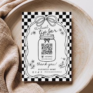 May include: Black and white printable sign with a checkered background. The sign says "Virtual Tip Jar" and features a mason jar with a QR code and the text "Venmo @yourbusiness". The sign also says "Thank you!" and includes space for a business name and social media handle.
