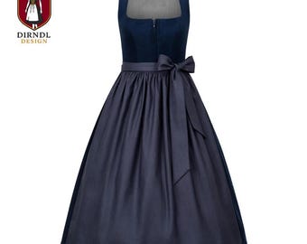 May include: A navy blue dirndl dress with a square neckline and a matching bow at the waist. The dress features a fitted bodice and a full skirt. The Dirndl Design logo is visible in the upper left corner.