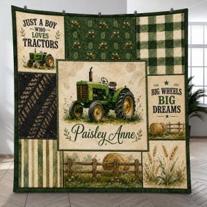 May include: A patchwork quilt featuring a green tractor, hay bales, and tire tracks. Text reads: Just a boy who loves tractors, Paisley Anne, and Big Wheels Big Dreams. The design includes green and cream plaid, striped, and patterned fabric blocks.