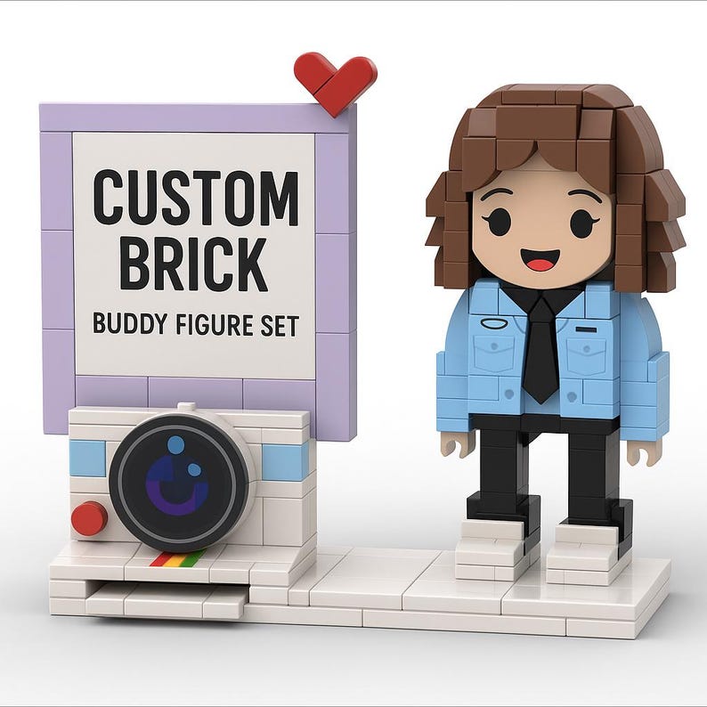 May include: A custom brick buddy figure set with a sign that reads "CUSTOM BRICK BUDDY FIGURE SET". The set includes a figure with brown hair, a blue jacket, and black pants, along with a camera and a red heart.