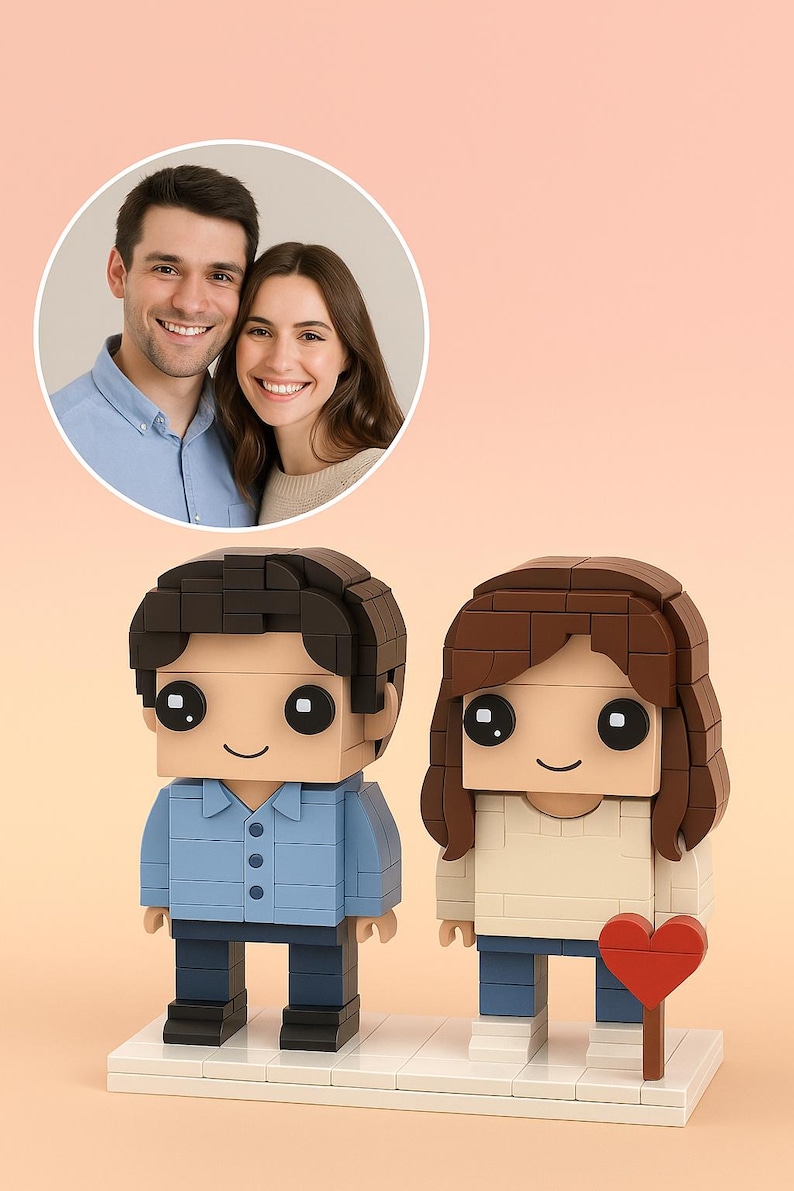 May include: A personalized Lego-style couple figurine with a photo in a circular frame. The male figure wears a blue shirt and the female figure wears a cream-colored top. A red heart is held by the female figure. The figures stand on a white base.