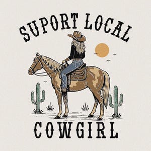 May include: A vintage-style illustration featuring a cowgirl on horseback, with the words "SUPPORT LOCAL COWGIRL". The design incorporates a desert landscape with cacti and a setting sun, creating a Western aesthetic.