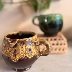 May include: A handmade wooden sign displaying the word "Welcome" in a handwritten font. The white-painted sign has a distressed finish, and a small green leaf adorns the top. Ideal for home decoration.