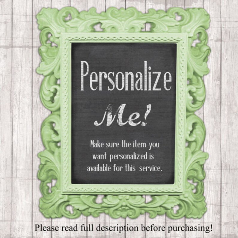 May include: A green framed chalkboard sign with the text "Personalize Me!" and the message "Make sure the item you want personalised is available for this service." The sign is on a white wood background.