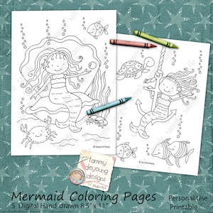 May include: Two 8.5" x 11" printable mermaid coloring pages with crayons. One page features a mermaid on a rock with a crab and fish. The other shows a mermaid on an anchor with a turtle and fish. The text says "Mermaid Coloring Pages".