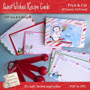 May include: A set of six printable recipe cards featuring a penguin chef design. The cards are decorated with red and white stripes and snowflakes. The text "Print & Cut" and "Tammy DeYoung" is visible on the image. The text "Gift box & 6 designs" is also visible. The cards are designed for writing down recipes and giving as gifts.