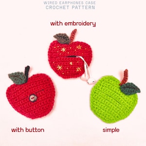 Crochet pouches for wired earphones. Small red apple with yellow embroidered stars, brown stem and dark green leaf on top. Red apple with brown stem and green leaf and a button. Green apple with brown stem and green leaf