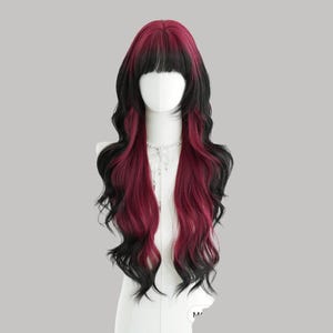 May include: A long, wavy wig with a two-tone design. The wig features a black fringe and black roots that transition into a deep red hue. The wig is styled on a mannequin head, showcasing its length and texture.