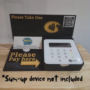 May include: Black point-of-sale display with the text "Please Take One" and "Please Pay here". Features a white payment terminal and a business card holder. The text "*Sum-up device not included" is at the bottom of the display.