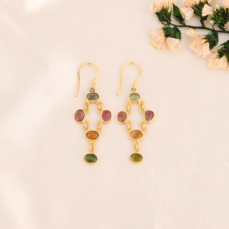 multi tourmaline, chandelier earrings, gemstone dangle, boho chic earrings, gold plated drops, natural stone jewelry, long drop earrings, handmade gemstone, colorful gem earrings, statement tourmaline, tourmaline jewelry, dangling brass earrings, oval cut earrings