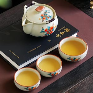 Juego de té de viaje de porcelana Ru pintado a mano, tetera y tazas de cerámica, arte portátil.