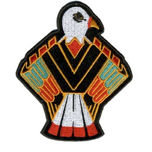 May include: Embroidered patch featuring a stylized eagle design. The patch has a black background with a large V-shape in the center. The eagle's head is white, and the wings are detailed with red, orange, and turquoise accents. The patch is approximately 4 inches wide.