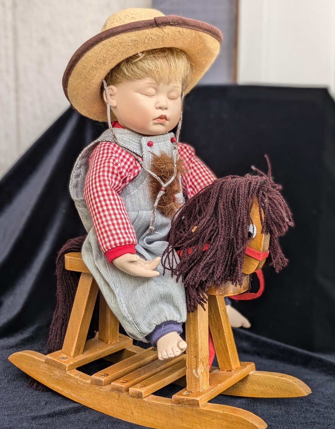 Porcelain doll on rocking horse hotsell