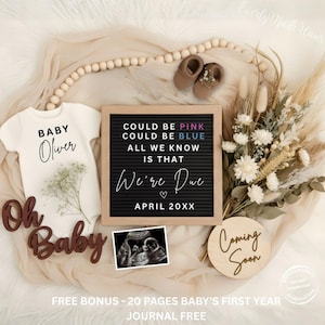 May include: A pregnancy announcement featuring a white onesie with "Baby Oliver" printed on it, a letter board with text, a sonogram, and a wooden sign that says "Coming Soon." The letter board reads "Could be Pink, Could be Blue, All we know is that We're Due April 20XX."