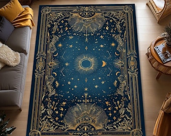 May include: A rectangular area rug featuring a deep blue background with intricate gold-colored celestial patterns, including a central sun, crescent moons, and scattered stars, all enclosed within an ornate, decorative border design.