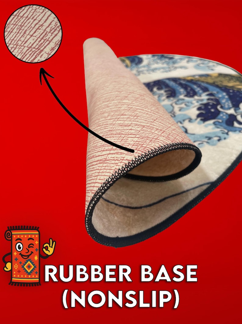May include: A rolled-up rug with a blue and white wave design, revealing a beige rubber base with a red pattern. The rug has a black stitched edge. Text on the image reads "RUBBER BASE (NONSLIP)".