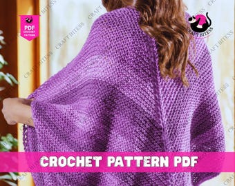 May include: A close-up of a purple crochet shawl. The shawl is made of thick yarn and has a textured appearance. The image includes the text "CROCHET PATTERN PDF" in a pink banner. The Craft Bitess logo is visible.