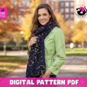 May include: A woman wearing a dark blue crochet scarf with yellow and pink accents. The scarf is wrapped around the neck and chest. The image also includes the text "DIGITAL PATTERN PDF".