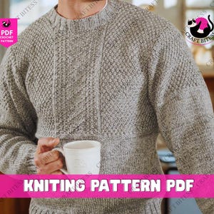 May include: A gray knitted sweater with textured patterns and a crew neck. The sweater has a central vertical design and a diamond pattern on the upper chest and sleeves. The image includes the text "KNITTING PATTERN PDF".