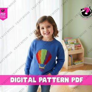 May include: A young person wearing a blue sweater with a colorful hot air balloon design. The sweater is a crochet pattern. The image includes the text "DIGITAL PATTERN PDF".